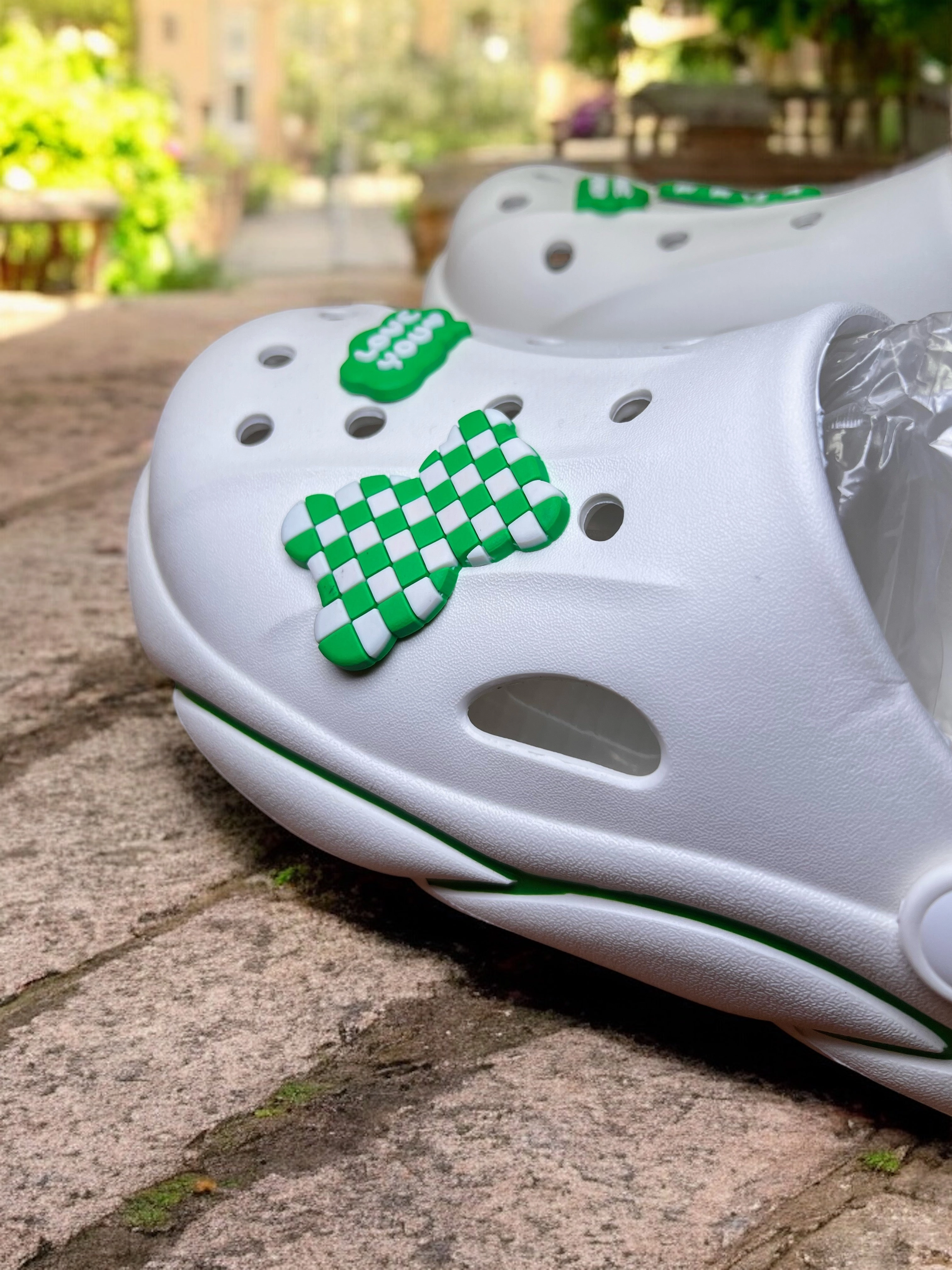 Trendy Slip-On Crocs with Checkerboard Charm and Love You Accent Born Clogs With Strap